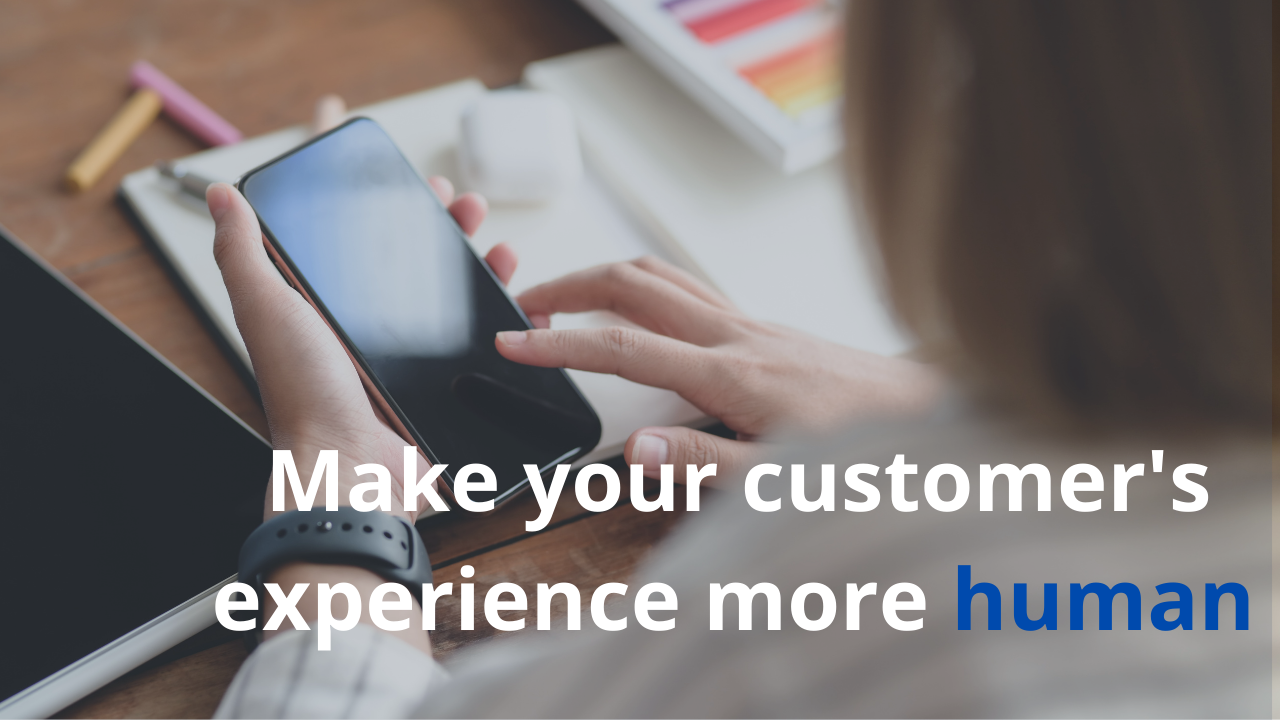 Woman holding a smartphone, with the words "Make your customer's experience more human."